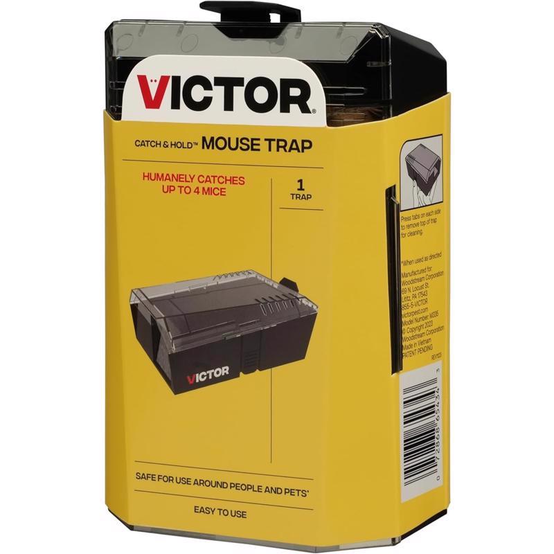 Emery Jensen multi-catch mouse and rat trap with bait, designed for pest control, shown set up on a surface.
