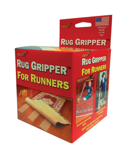 Emery Jensen Lok-lift Gripper Runner non-slip rug pad on hardwood floor, preventing slipping and protecting surface.