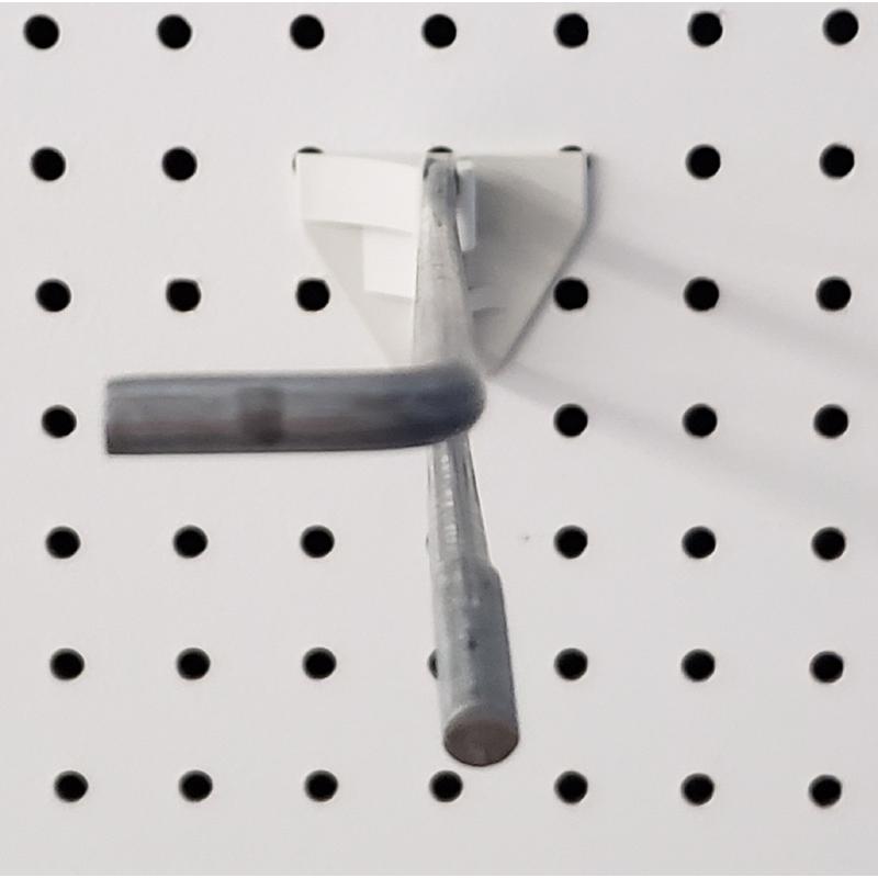 Emery Jensen peg hooks with 3-peg backplate for store displays, shown in a pack of 50, mounted on a retail wall.