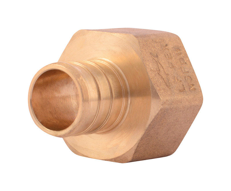 Emery Jensen PEX brass crimp fitting 3/4 inch in a bag, showing a close-up of the fitting's threaded end and smooth brass surface.