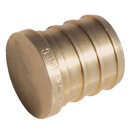 Emery Jensen PEX test plug 3/4 barb fitting in a bag, used for plumbing system testing and connections.