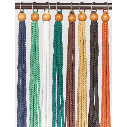 Emery Jensen macrame plant hanger, a natural fiber wall-mounted plant holder with intricate knot details for indoor decor.