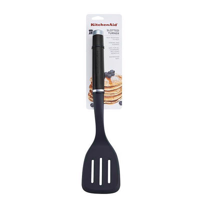 Black nylon slotted turner with plastic handle from Emery Jensen, ideal for flipping and serving food in the kitchen.