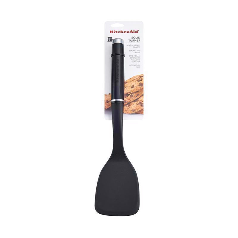 Black nylon handle solid turner from Emery Jensen, a plastic utensil ideal for flipping and serving in the kitchen.