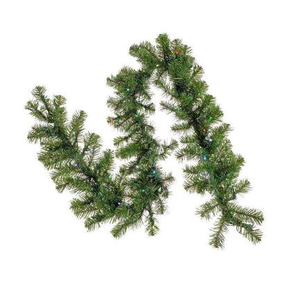 Emery Jensen Brilliant Lit 9-foot prelit garland with warm white lights and lush green pine branches for holiday decoration.
