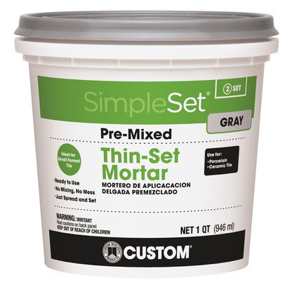 Emery Jensen ceramic premixed thin-set grout in gray color, suitable for tile installation, shown in a close-up image.