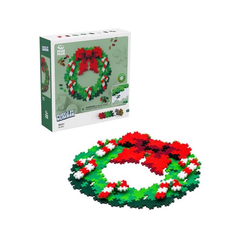 Emery Jensen CMAS Wreath 500-piece puzzle showing a festive wreath design on a flat surface.