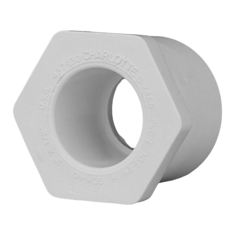Emery Jensen PVC pressure fitting bushing SCH40 1x1/2 SPGXS for plumbing applications, shown in a close-up image.