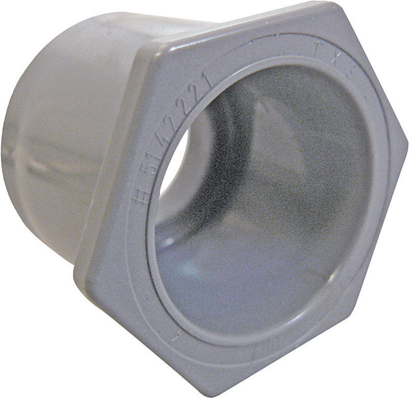 PVC SCH 40/80 reducer fitting from Emery Jensen, 1-1/4 inch to 1 inch, used for plumbing connections.