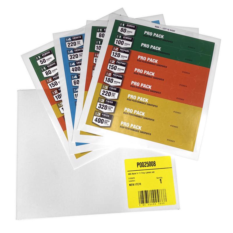 White 9x10-inch tray labels for signage and sign holders by Emery Jensen, shown in a retail display setting.