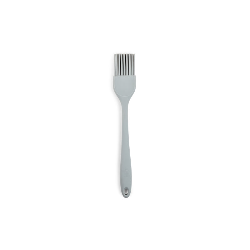Emery Jensen silicone basting brush with a black handle and flexible silicone bristles for even coating and easy cleaning.