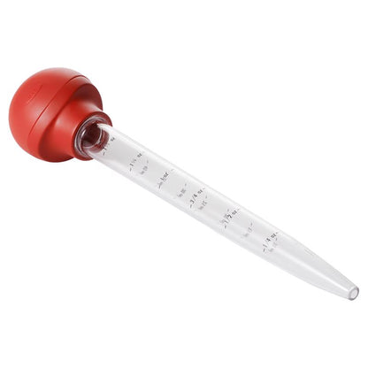Red plastic baster from Emery Jensen, a specialty kitchen gadget with a flexible bulb and long nozzle for precise basting.