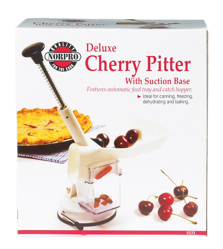 Emery Jensen cherry pitter, a specialty gadget, showing a close-up of the device used to remove pits from cherries.