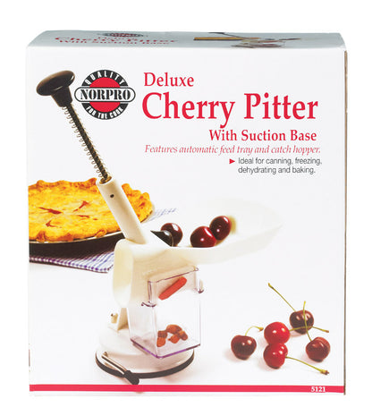 Emery Jensen cherry pitter, a specialty gadget, showing a close-up of the device used to remove pits from cherries.