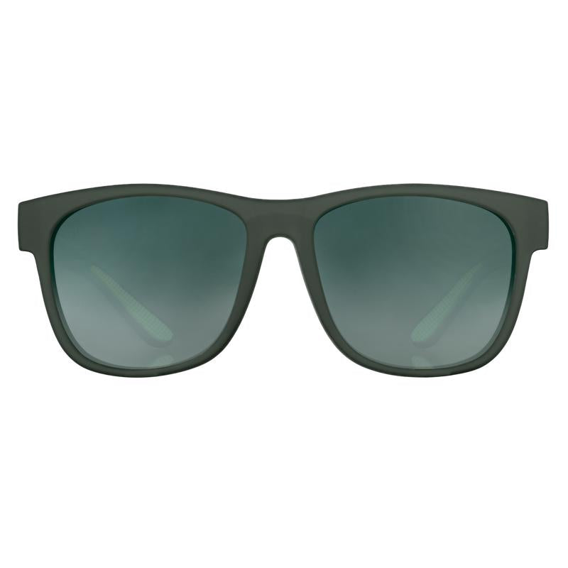 Emery Jensen sports sunglasses with green tinted lenses and sleek frame, designed for active outdoor use.