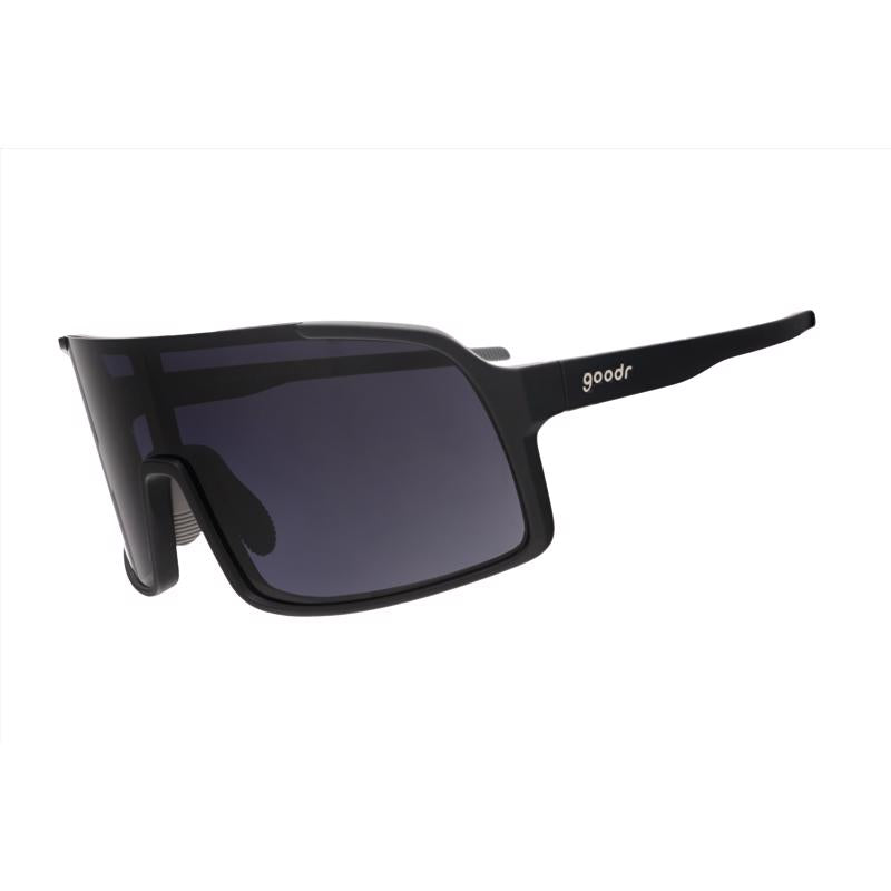 Emery Jensen sports sunglasses with black frame and tinted lenses, designed for outdoor activities and sun protection.
