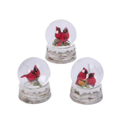 Set of three Emery Jensen Cardinal Water Globes, tabletop decor with water and decorative elements inside clear glass globes.