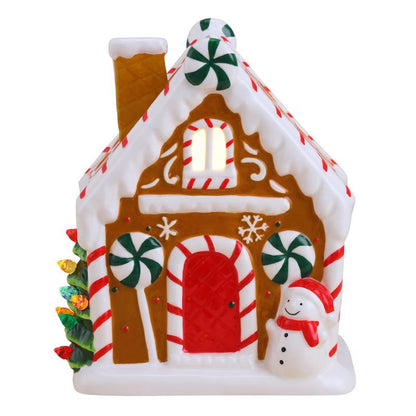 Emery Jensen tabletop decor featuring a gingerbread house with festive details, perfect for holiday home decoration.