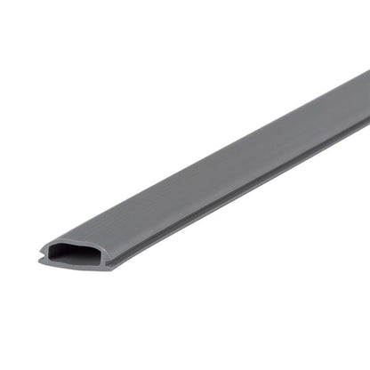 Emery Jensen vinyl threshold strip for door transition, showing a close-up of the brown plastic strip on a wooden floor.