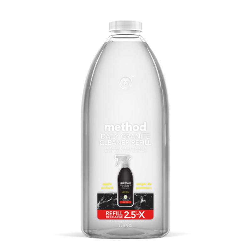 Emery Jensen grout and tile cleaner spray in orange, designed for deep cleaning and brightening grout and tile surfaces.