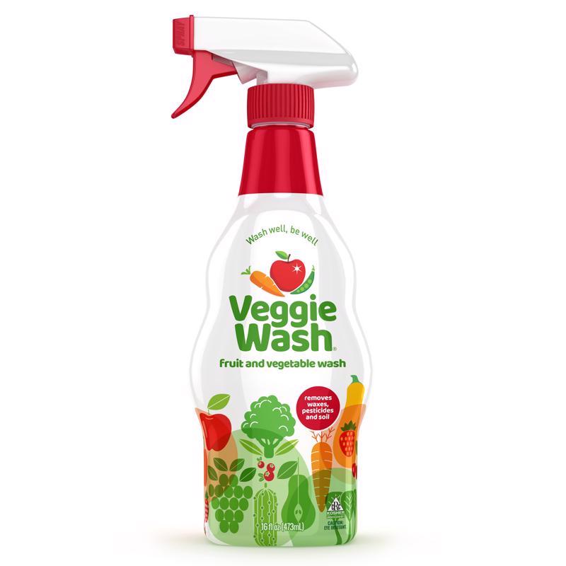 Emery Jensen Fruit and Vegetable Wash 16oz water rinse to clean produce visibly with fresh fruit and vegetable in background.