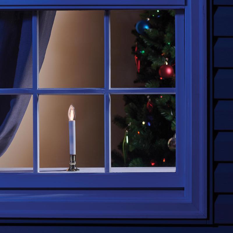 Emery Jensen 9-inch warm white LED window candle with flickering flame and clear glass holder, perfect for decorative display.