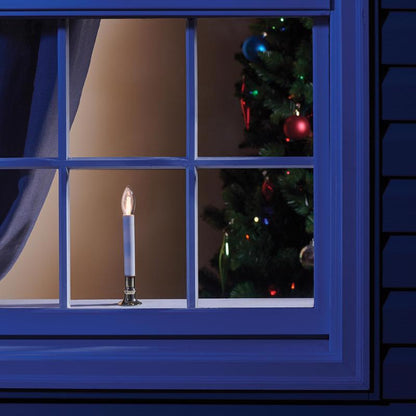Emery Jensen 9-inch warm white LED window candle with flickering flame and clear glass holder, perfect for decorative display.