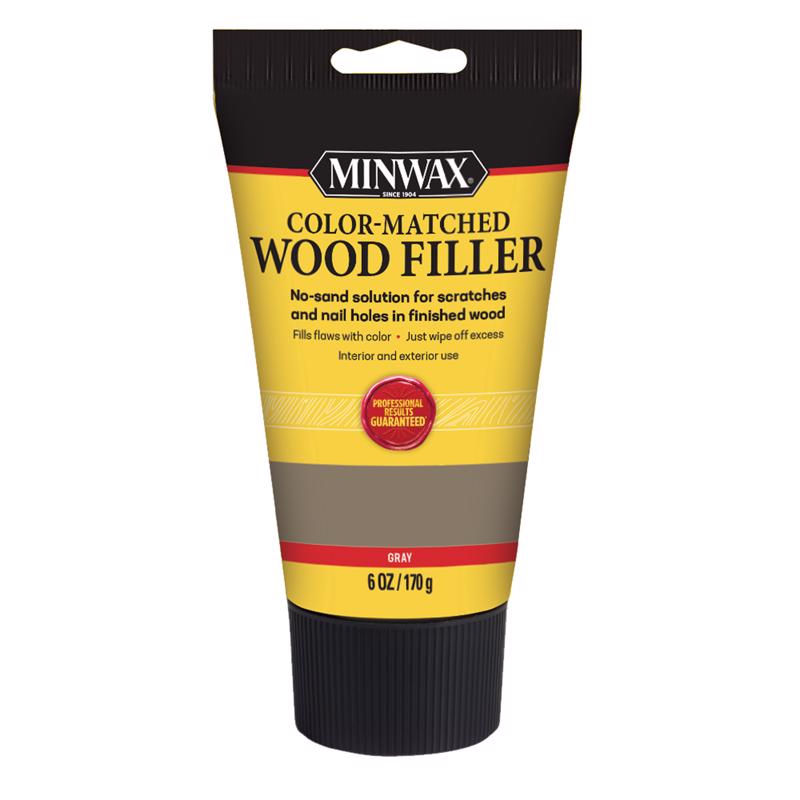 Emery Jensen gray wood filler in a 6oz container, suitable for indoor repairs and wood surface filling.