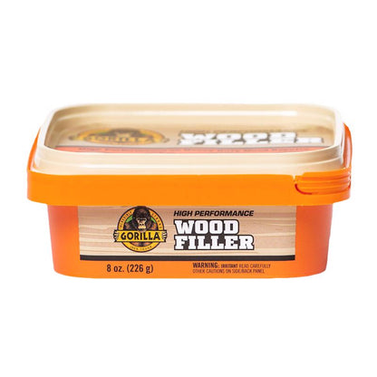 Four 8oz containers of Emery Jensen natural wood filler, ideal for repairing and filling wood surfaces.