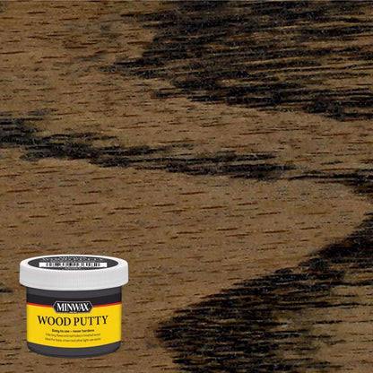 Emery Jensen ebony wood putty dough in a 3.75oz container, suitable for repairing and filling wood surfaces.