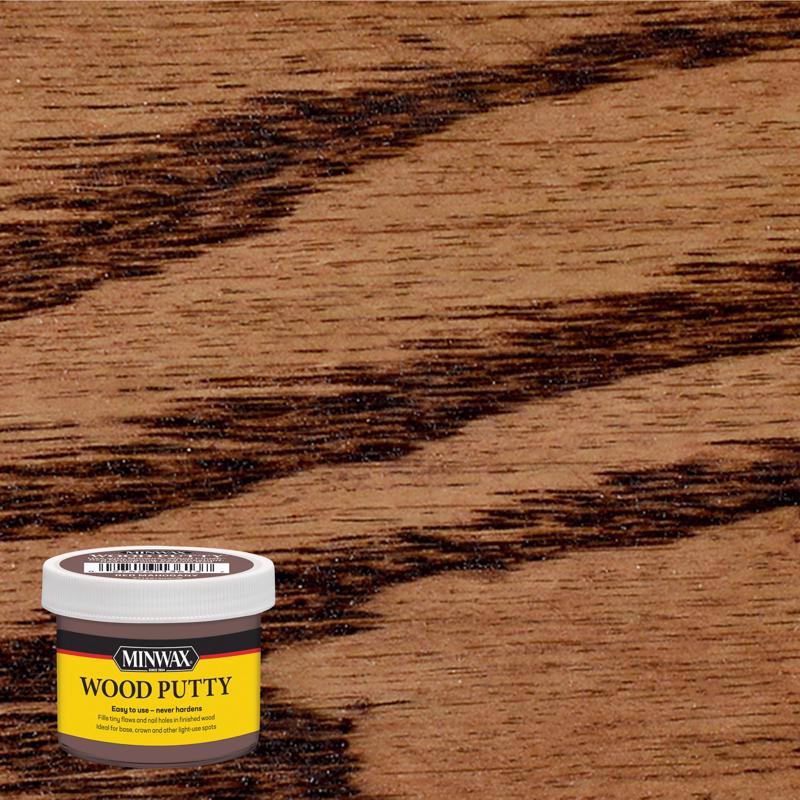 Red mahogany wood putty dough by Emery Jensen for repairing and filling wood surfaces with natural color and texture.