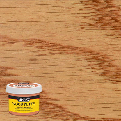Emery Jensen Wood Putty Dough in Colonial Maple color, showing a close-up of the creamy wood filler for repairing wood surfaces.